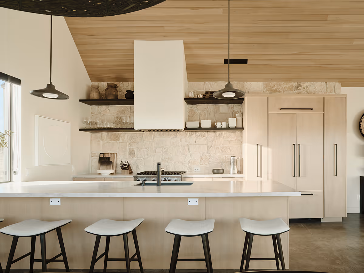 Light and bright kitchen with a wood ceiling at a modern Scandinavian house in Flagstaff, Arizona by The Ranch Mine