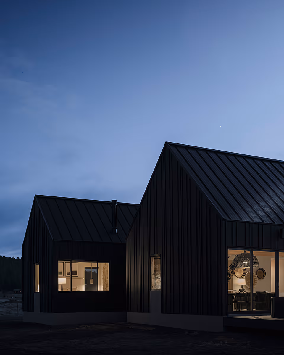 Modern Scandinavian black exterior house with gabled roofs in Flagstaff, Arizona by The Ranch Mine at night