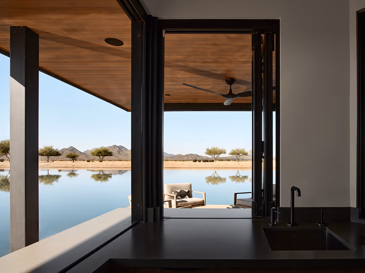pass through window from kitchen in a modern boat house on a water ski lake in Arizona by The Ranch Mine
