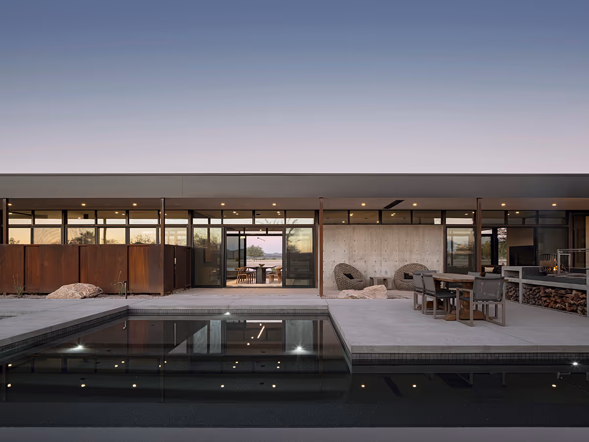 baja shelf and outdoor dining at dusk at a desert modern house in Arizona by The Ranch Mine