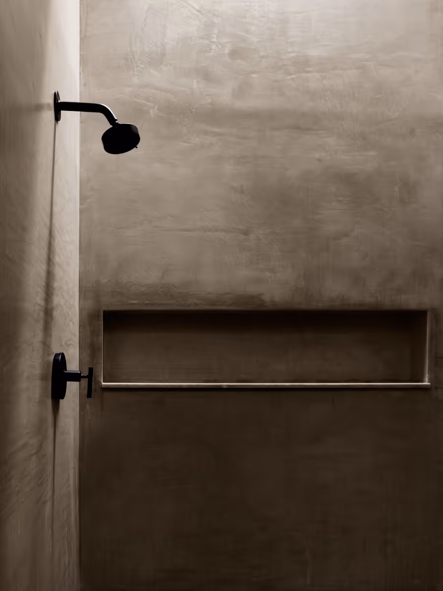 plastered shower lit by skylight by The Ranch Mine