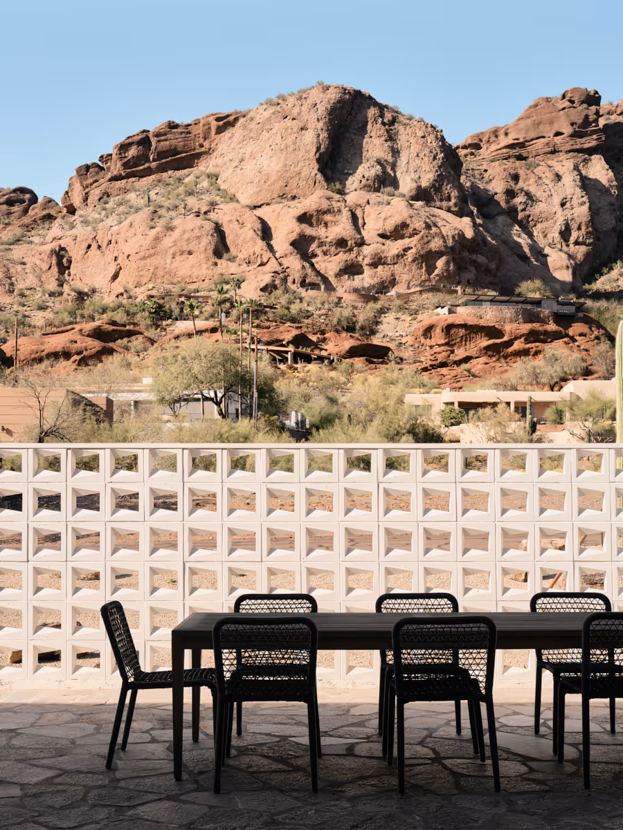 breeze block wall with camelback mountain beyond by The Ranch Mine