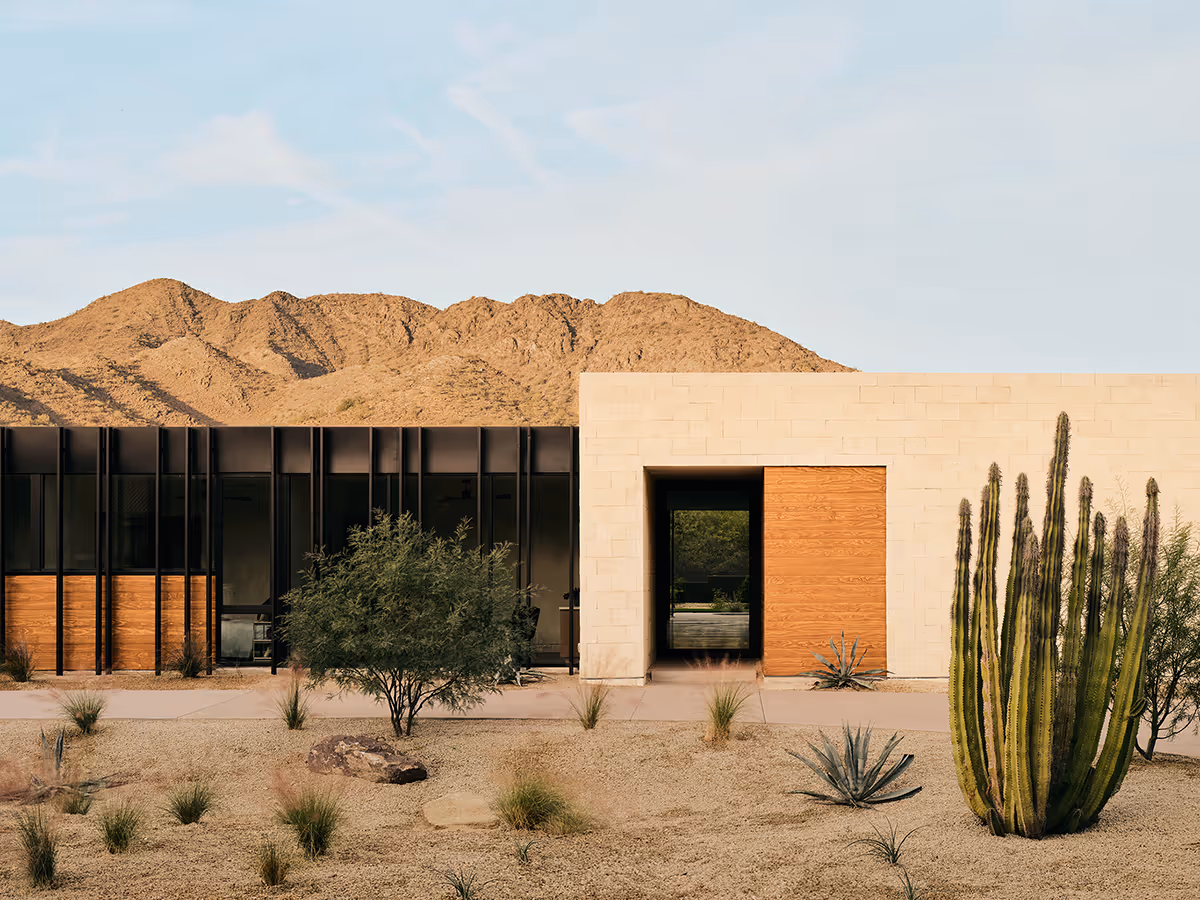 modern desert house with mountains in the background