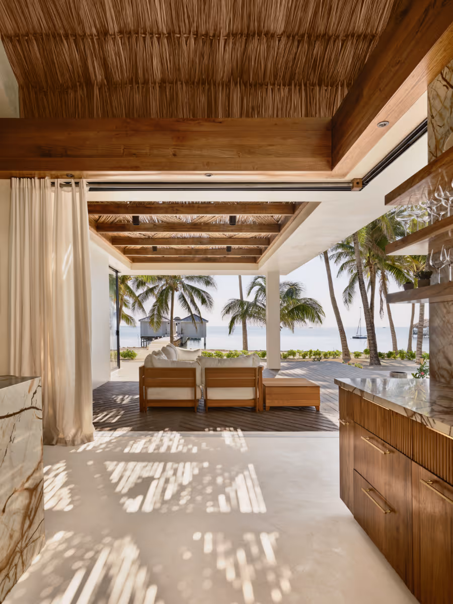 Corner pocketing glass doors at a tropical modern house in Belize by The Ranch Mine