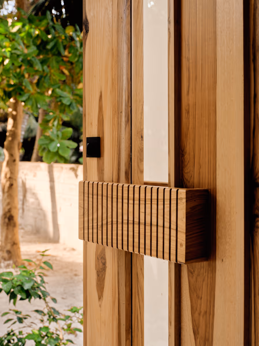 Custom sam wood door at a tropical modern house in Belize by The Ranch Mine