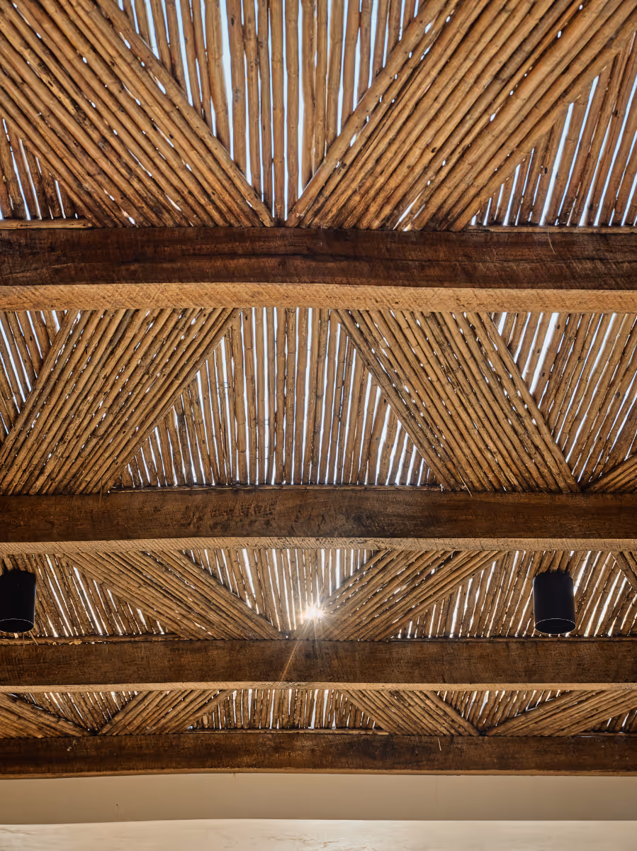 Custom pergola at a tropical modern house in Belize by The Ranch Mine