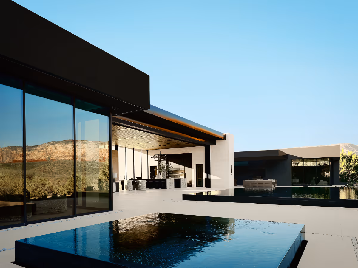 Negative-edge hot tub reflecting the sky in modern new build home in Seven Canyons in Sedona by The Ranch Mine