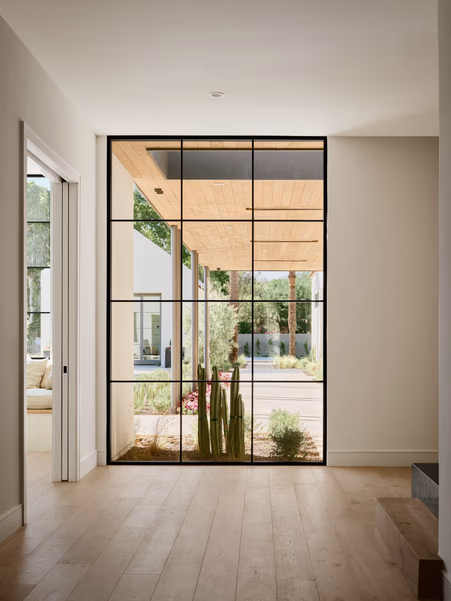 Hallway with controlled apertures, light and shadow defining movement, by The Ranch Mine