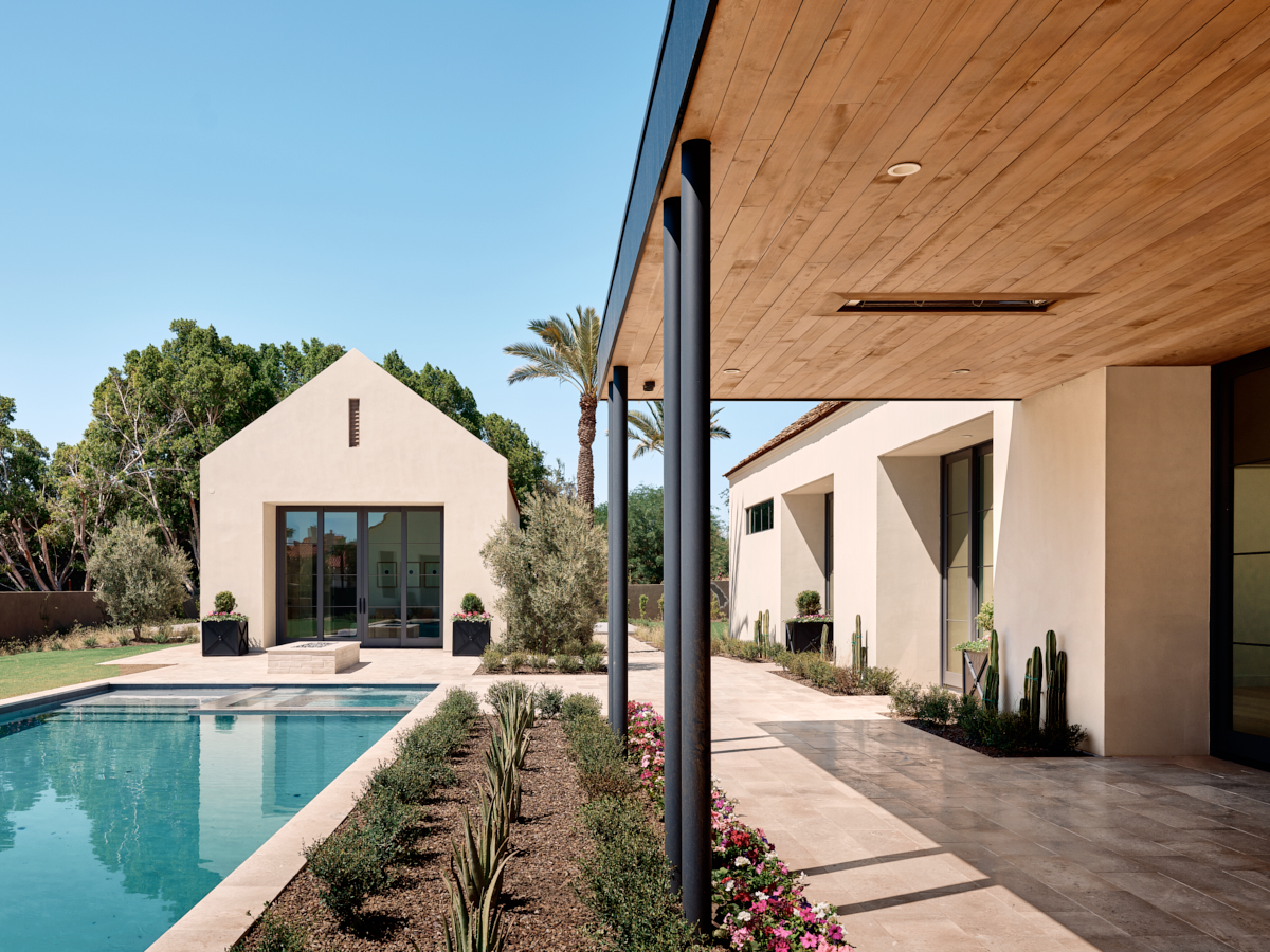 Pool edge and planting forming a refined court for gatherings and laps, by The Ranch Mine.