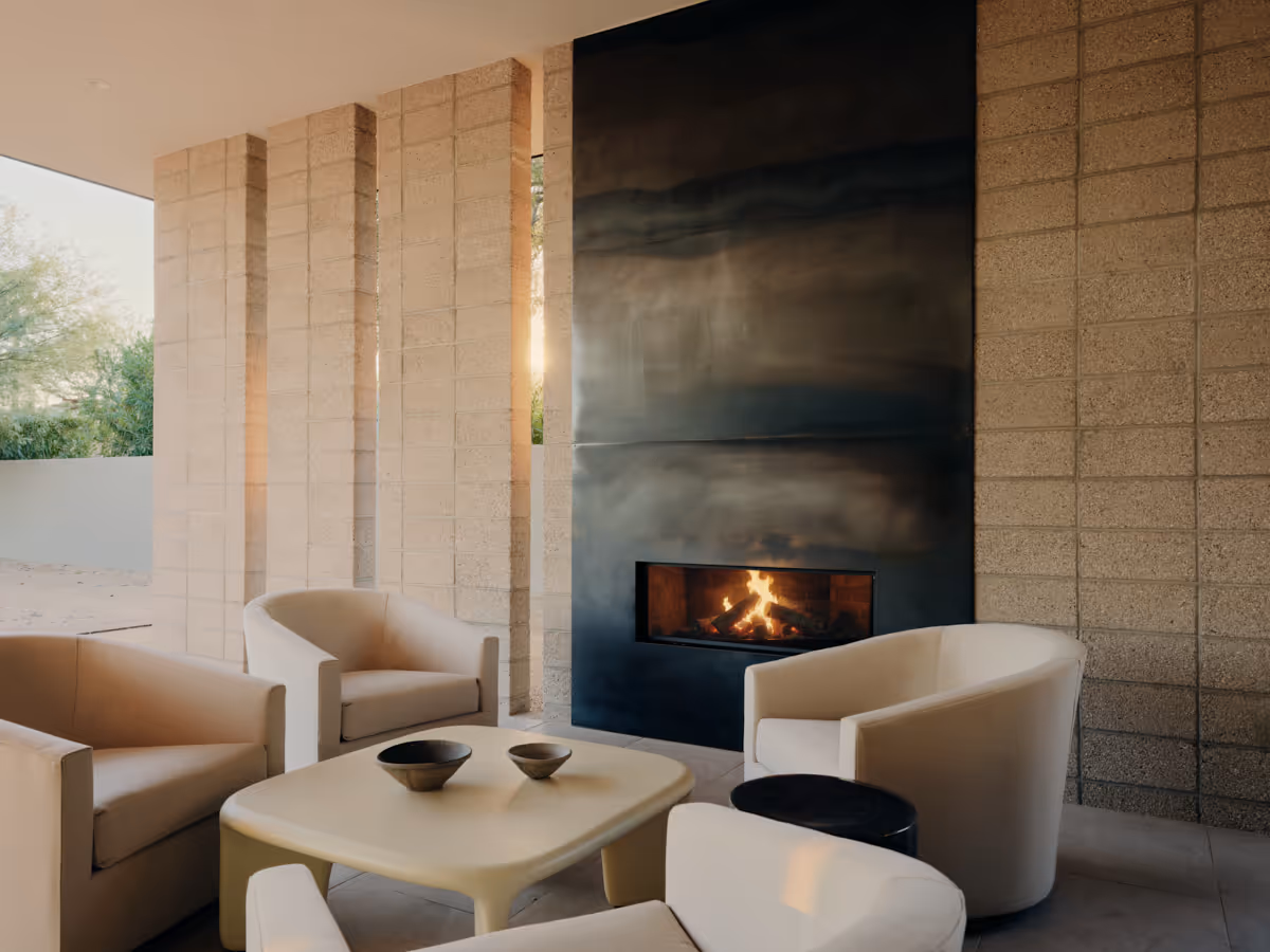 covered patio with fireplace  at Full Circle, a multigenerational new build compound in Paradise Valley, Arizona by The Ranch Mine