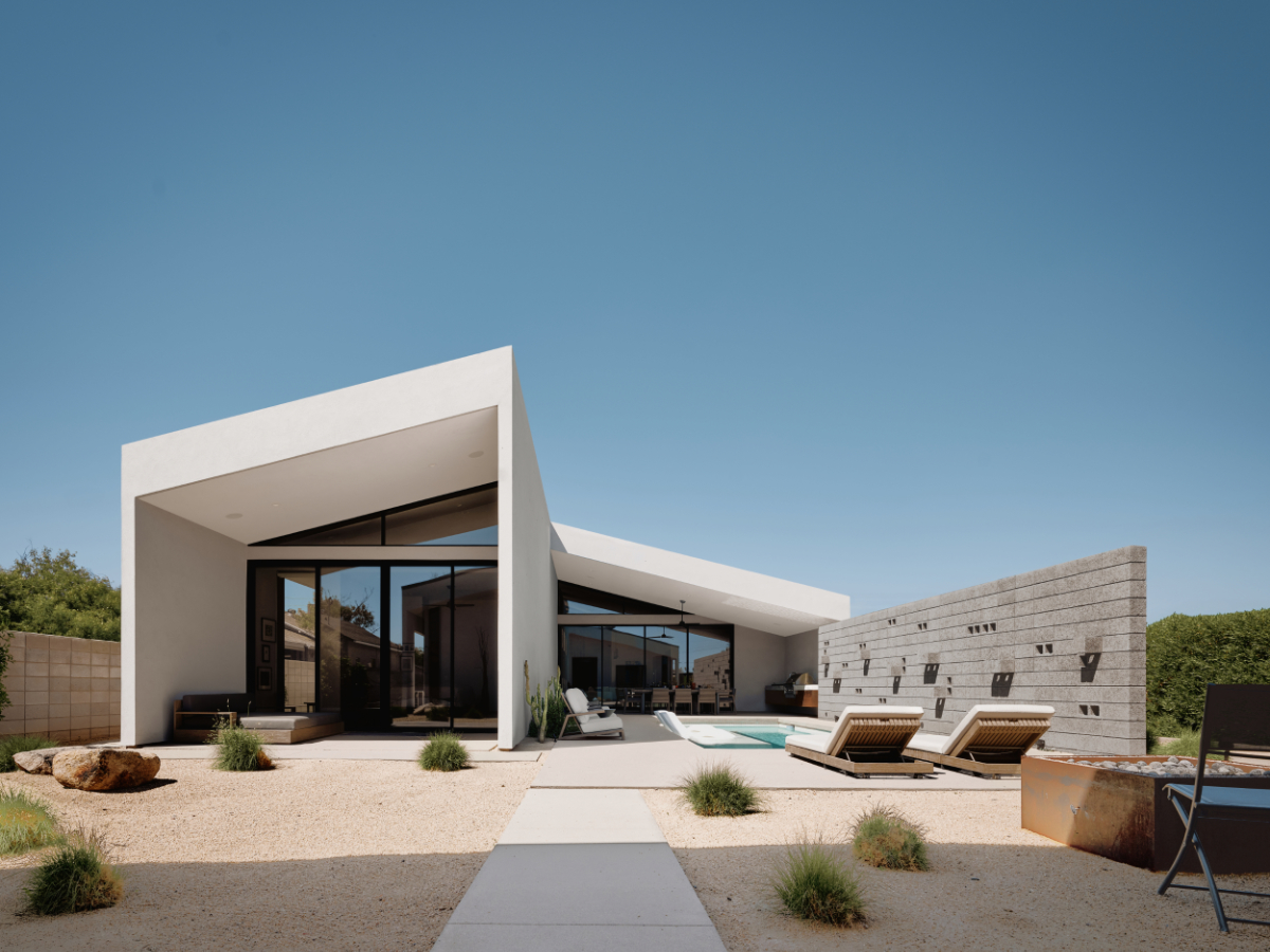 a modern offset gable house in Phoenix Arizona for an artist with concrete block and white stucco and a courtyard pool
