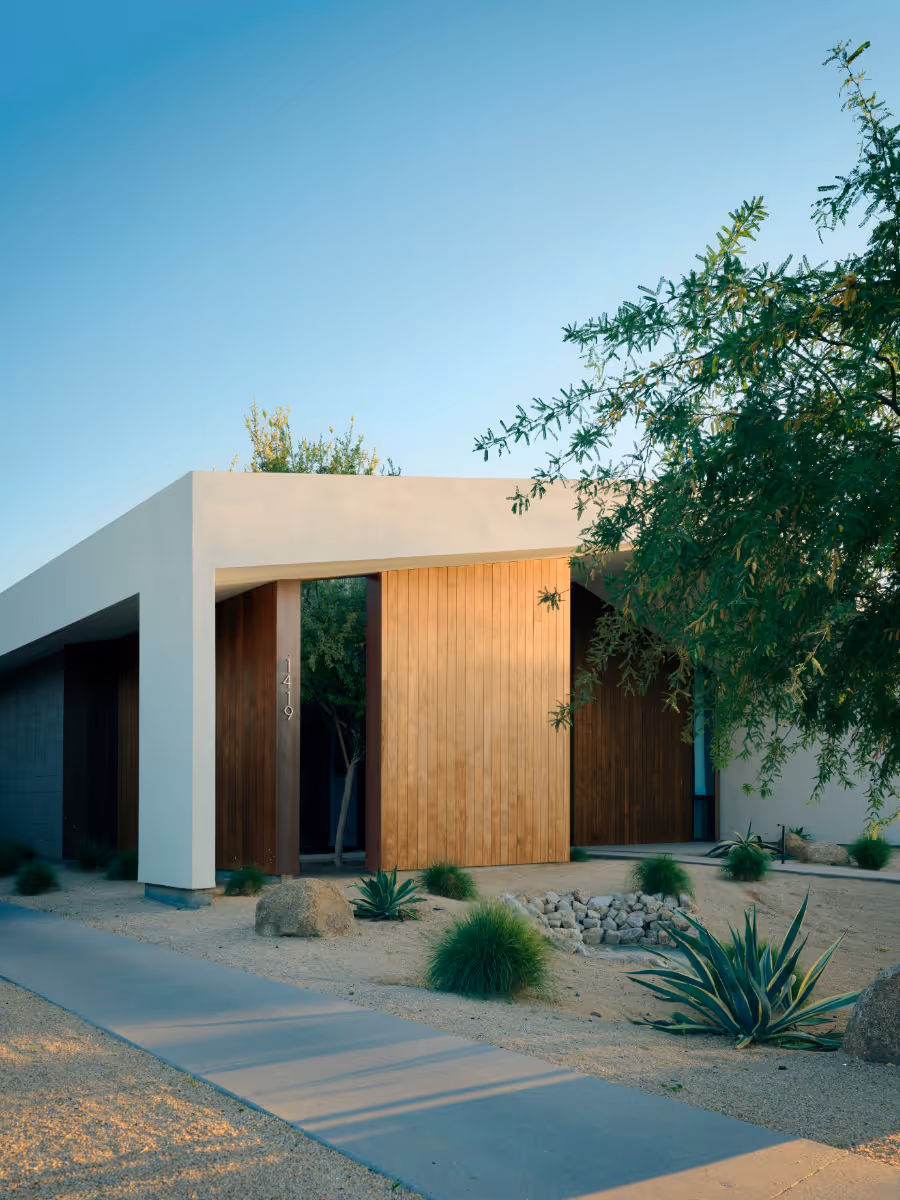 a modern offset gable house in Phoenix Arizona for an artist with wood and white stucco