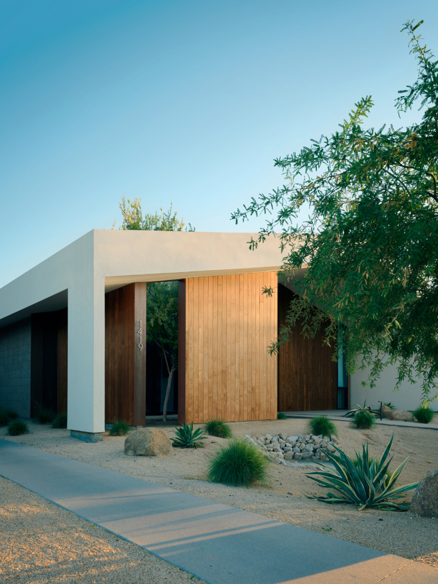 a modern offset gable house in Phoenix Arizona for an artist with wood and white stucco