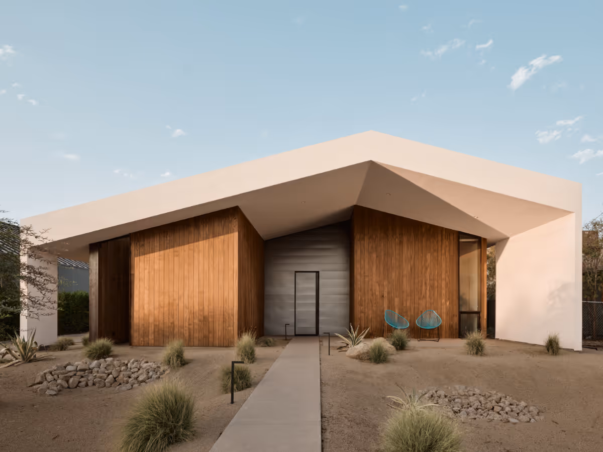 a modern offset gable house in Phoenix Arizona for an artist with wood and white stucco