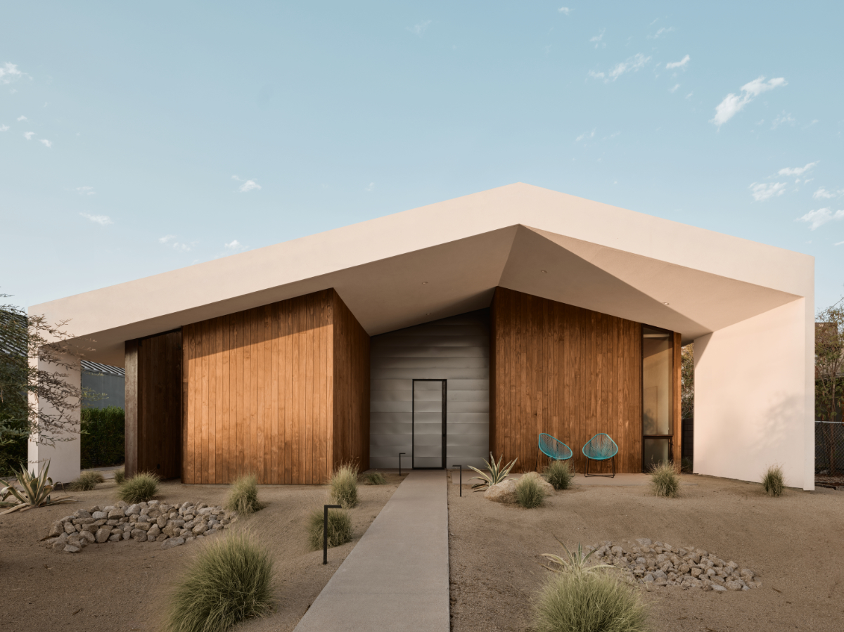 a modern offset gable house in Phoenix Arizona for an artist with wood and white stucco