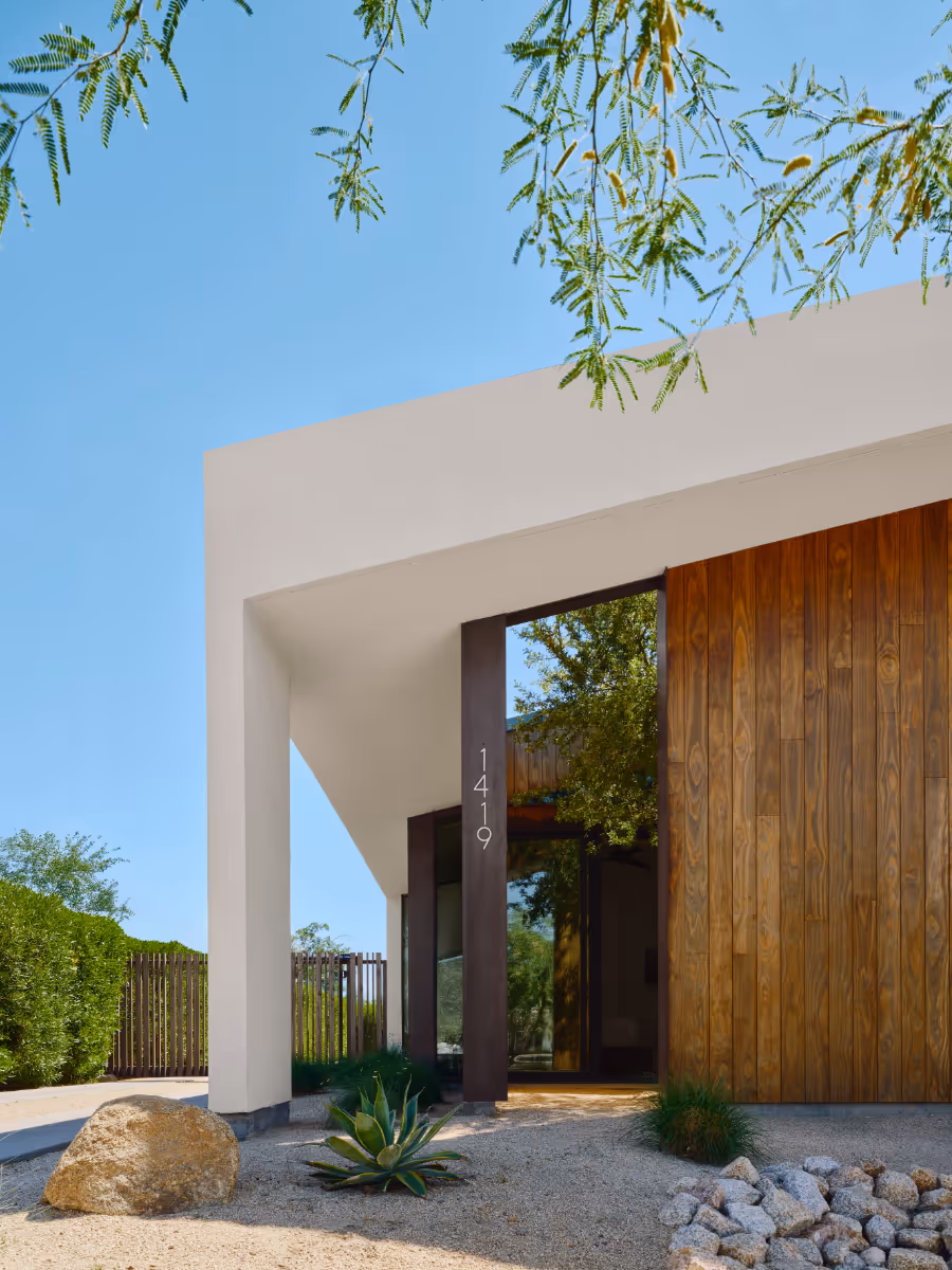 a modern offset gable house in Phoenix Arizona for an artist with wood and white stucco