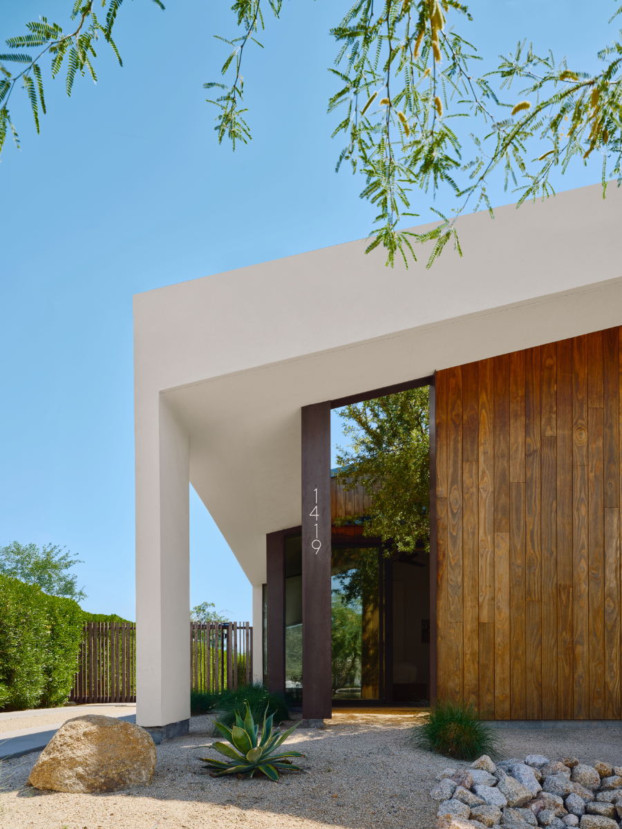 a modern offset gable house in Phoenix Arizona for an artist with wood and white stucco