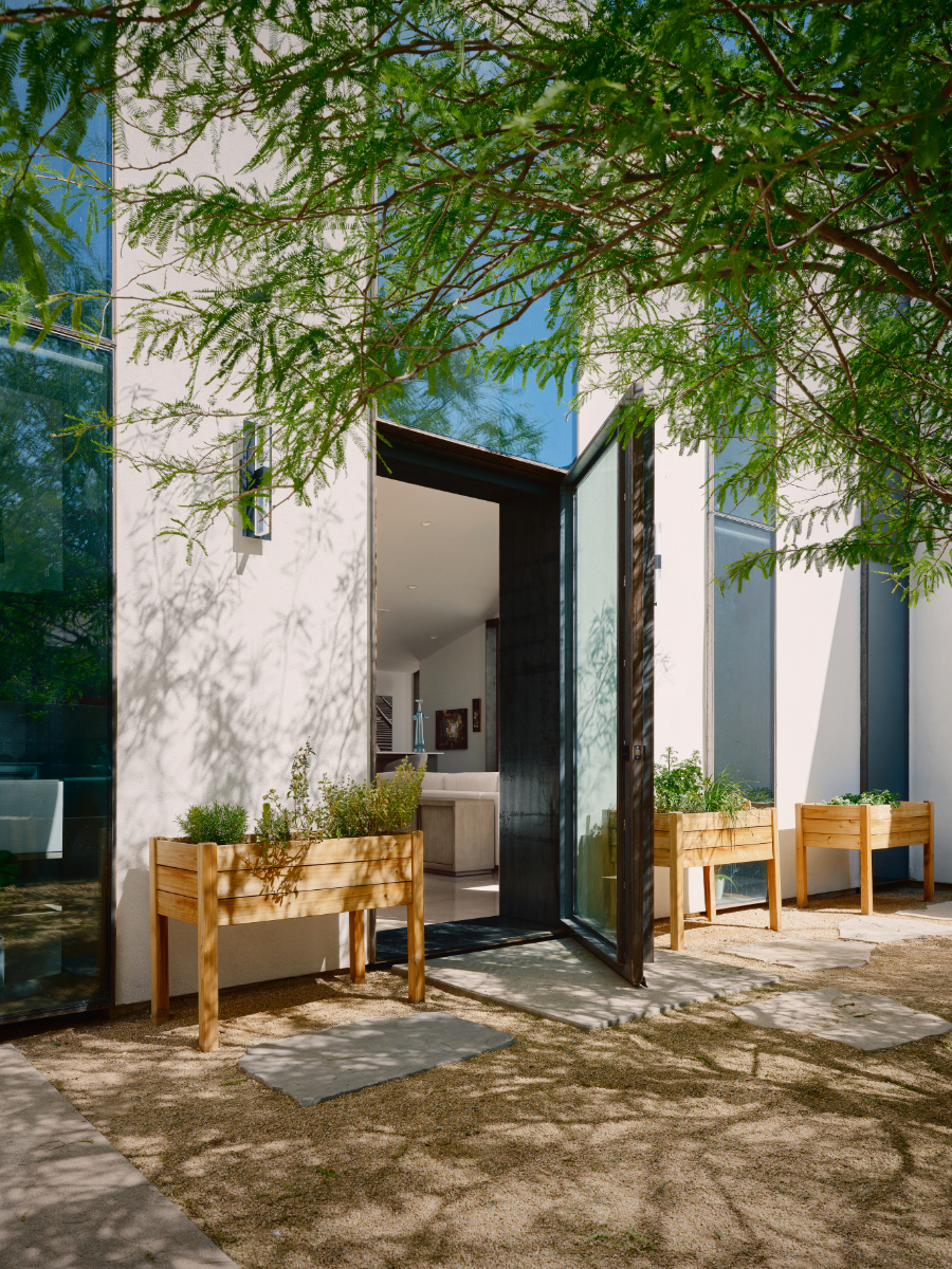 desert courtyard house with raised planters for an artist