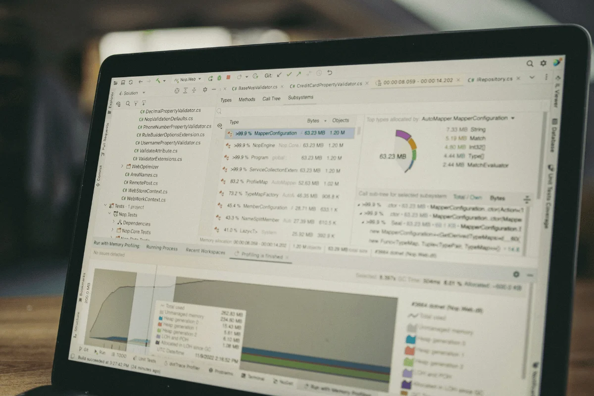 Laptop screen showing memory profiling and software performance metrics during code analysis.