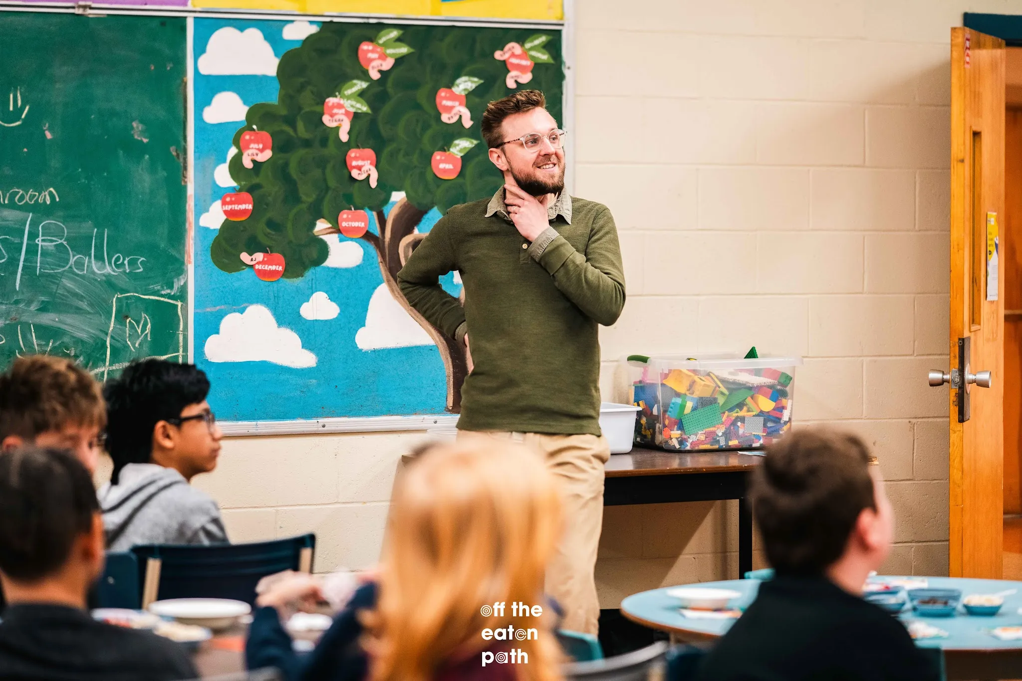 An educator speaks with students during the Taste Lab workshop.