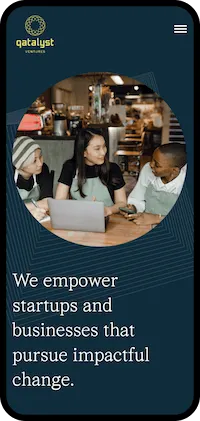 Three diverse professionals collaborating with a laptop in a modern cafe, promoting startup empowerment.