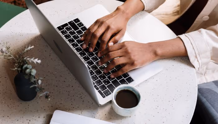 person writing on desk