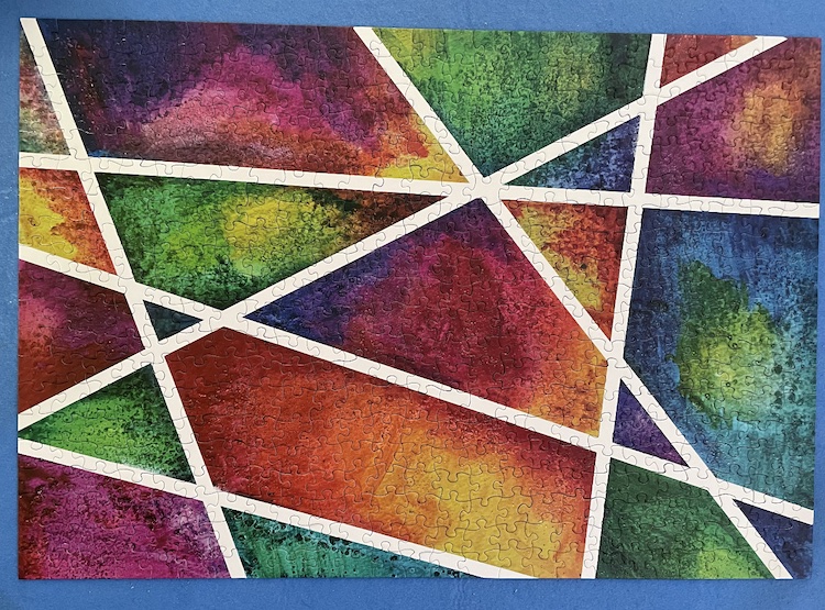 A gradient puzzle with colored sections divided by white lines