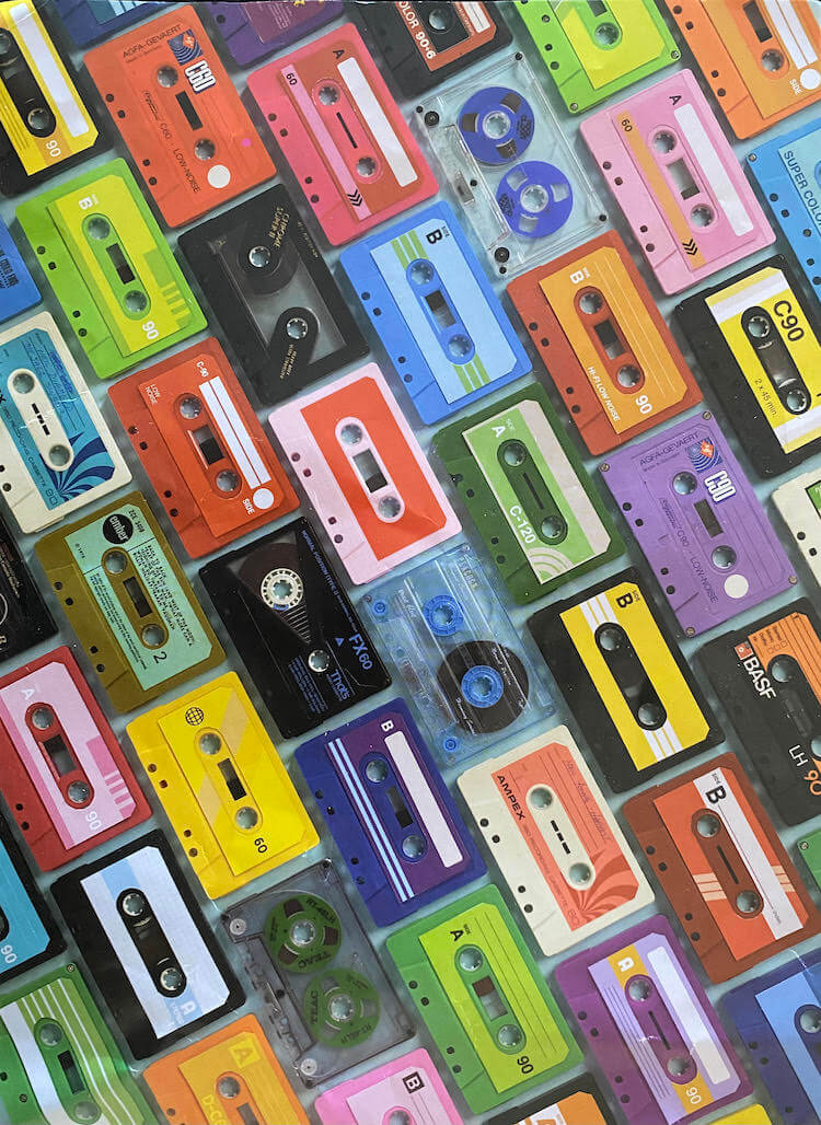 A puzzle picture of music tapes of different colors