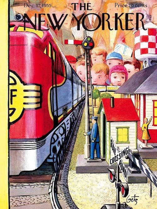 Red model train with children peering over