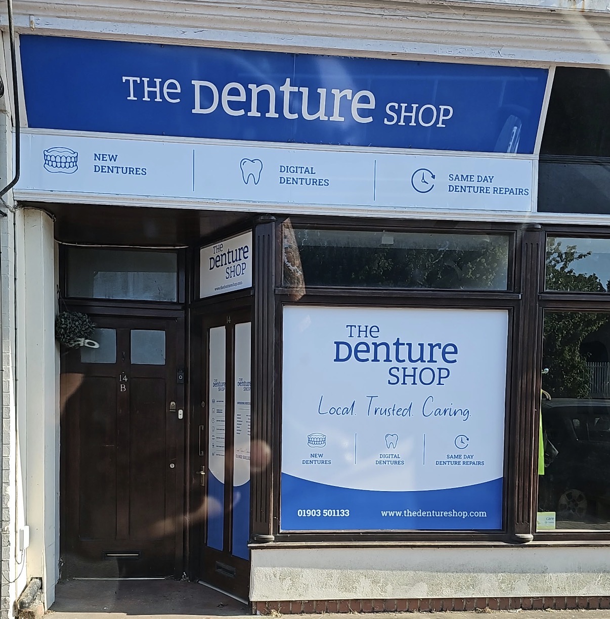 The Denture Shop shopfront fascia and window graphics.