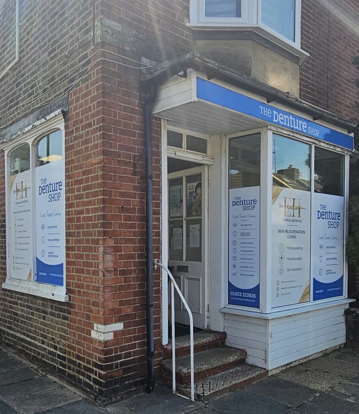 Window graphics wrapping around The Denture Shop's corner shopfront.
