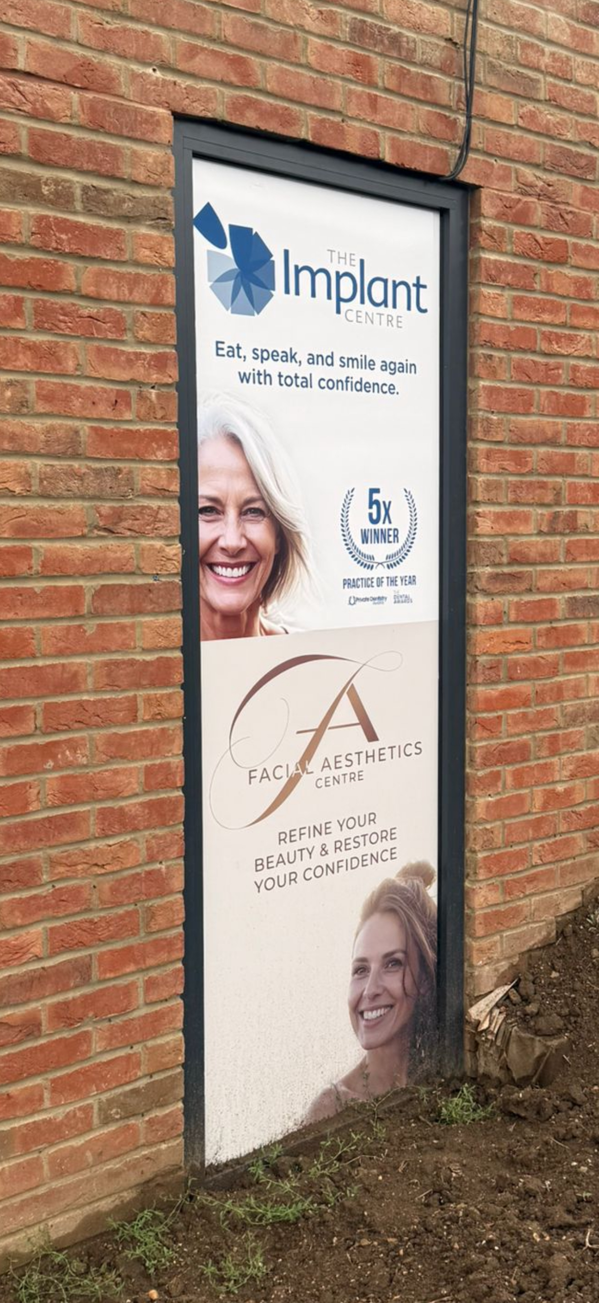 Tall entrance panel for The Implant Centre and Facial Aesthetics Centre.