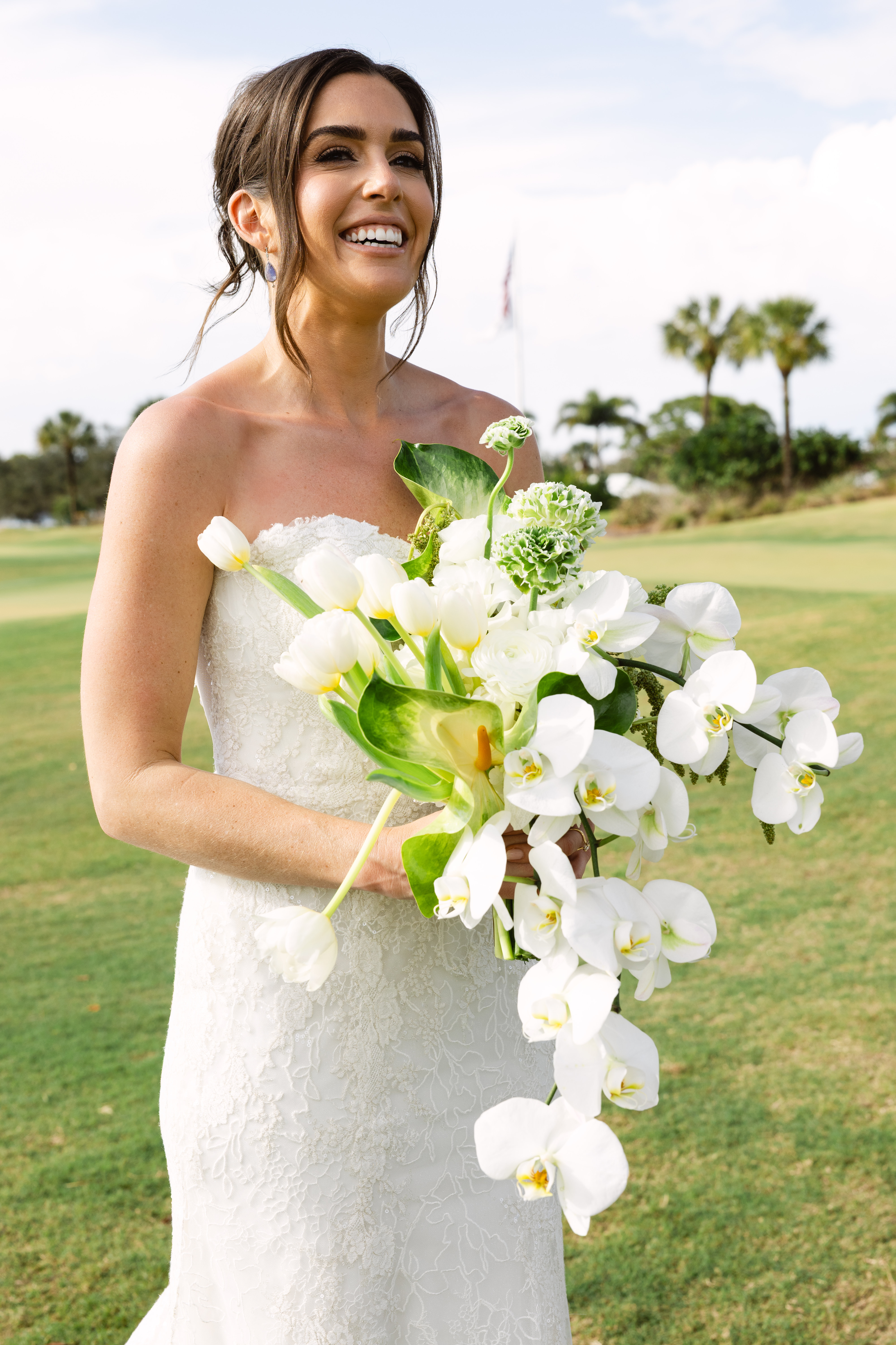 Bride holding her white wedding bouquet during a Turtle Creek Country Club wedding.