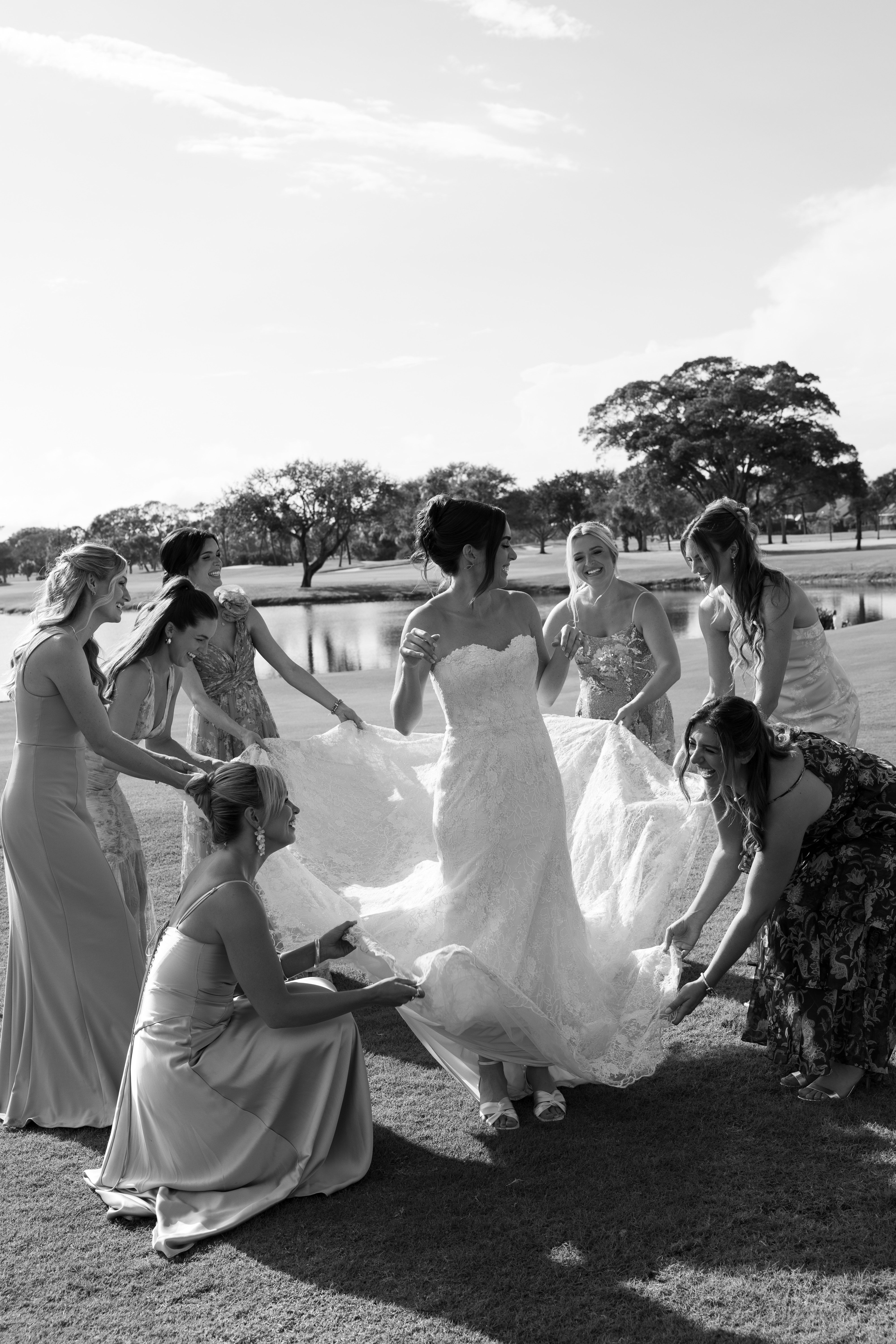 Bridesmaids gathered together outdoors before the wedding ceremony.