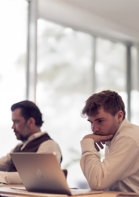 Men working at computer