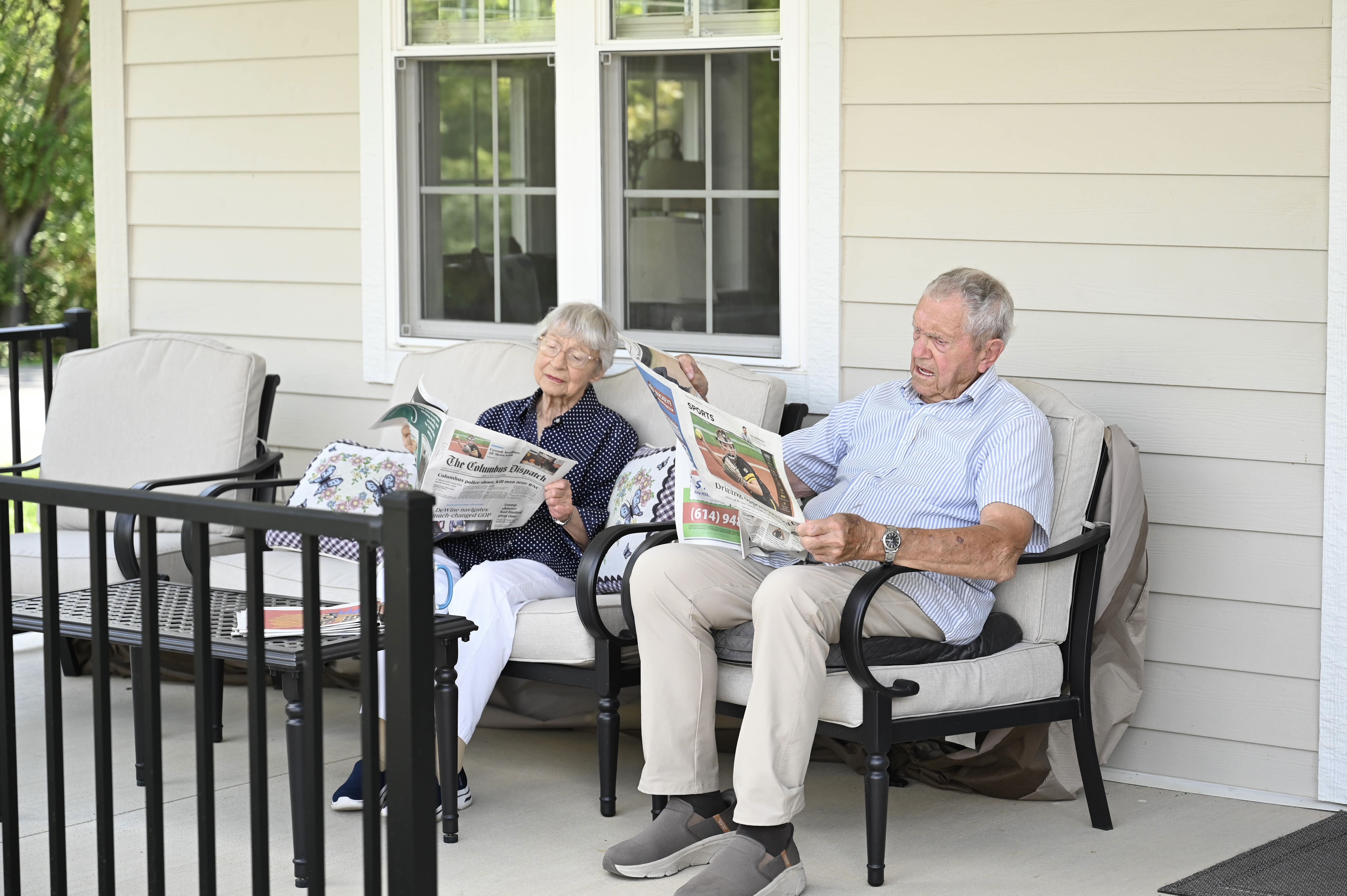 An elderly couple enjoys their morning coffee and newspaper in Central Ohio at Sovereign Village Base