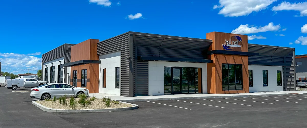 Photo of the outside of the new Tel Net Office on a sunny blue sky day.