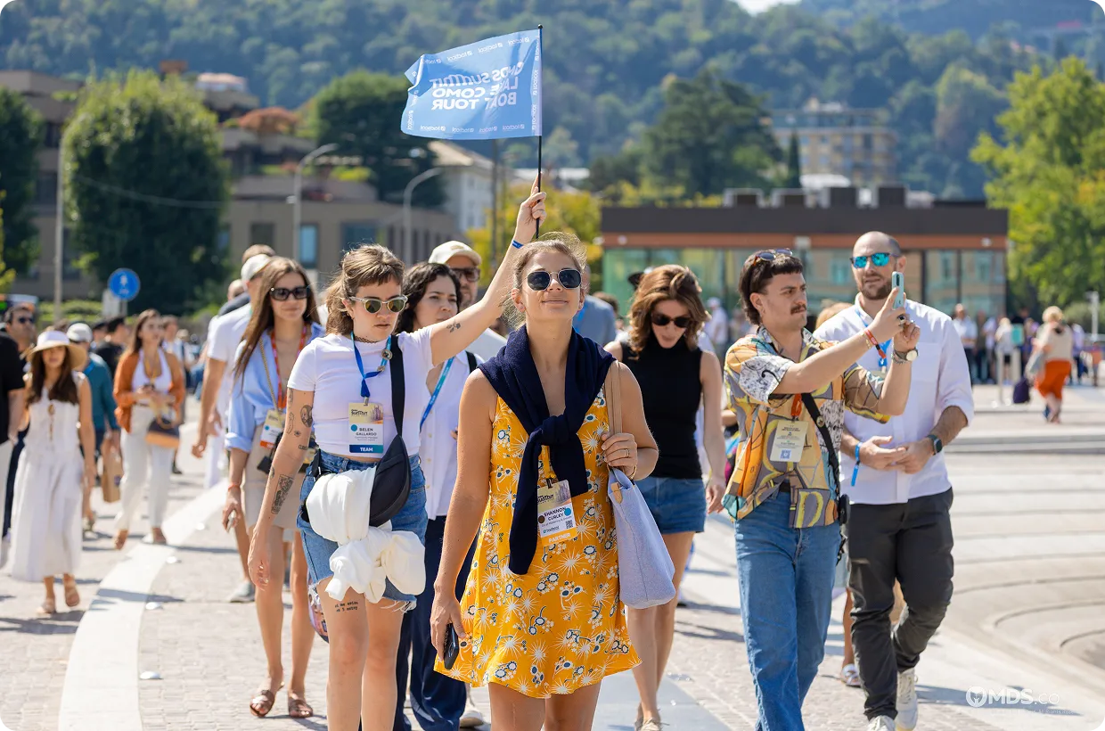 Summit attendees walking together during an outdoor group activity