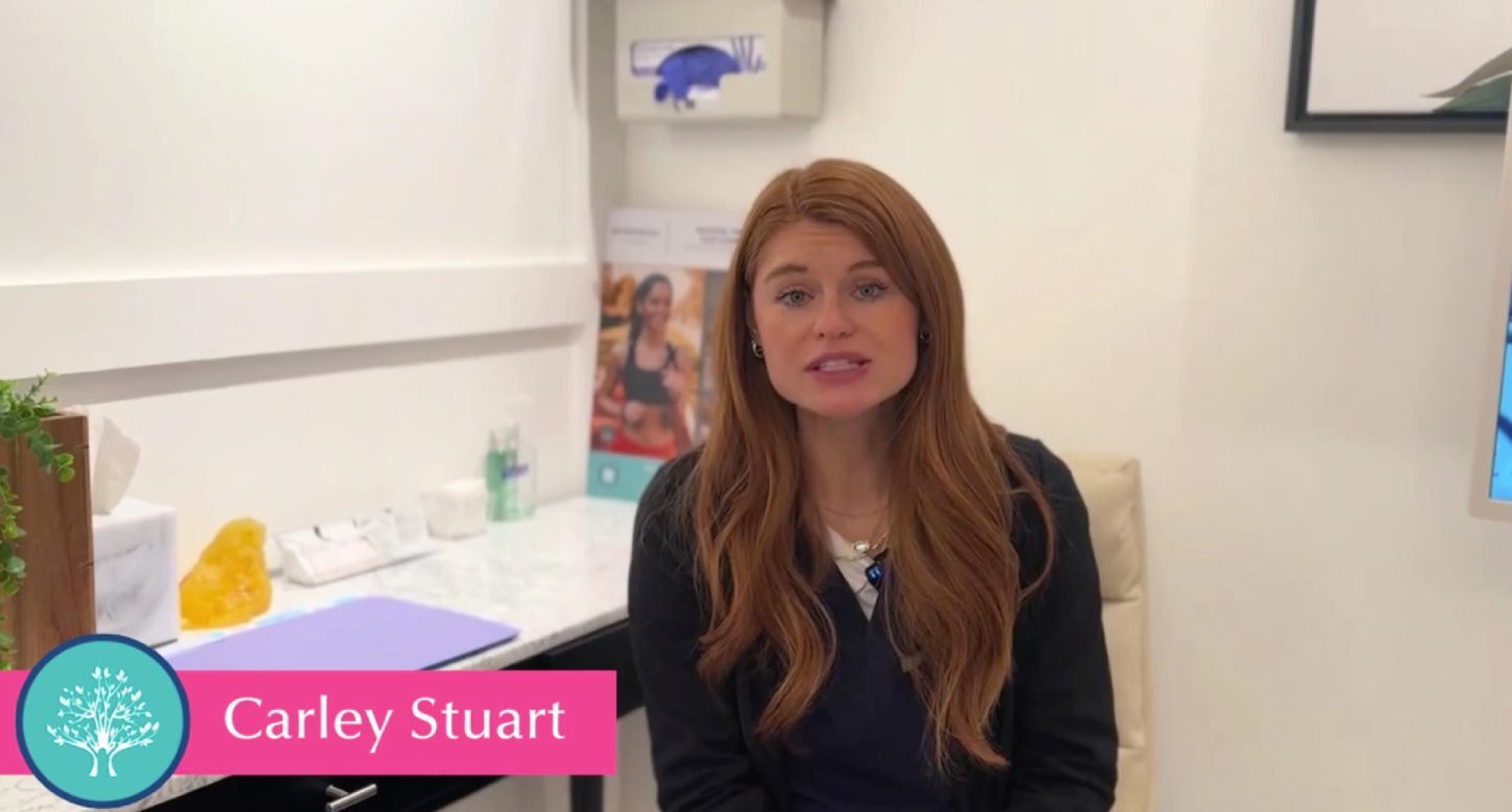 Carley Stuart speaking in an office.