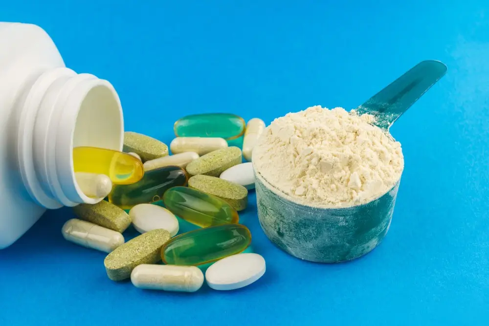 Supplements: capsules, tablets, powder on blue background.