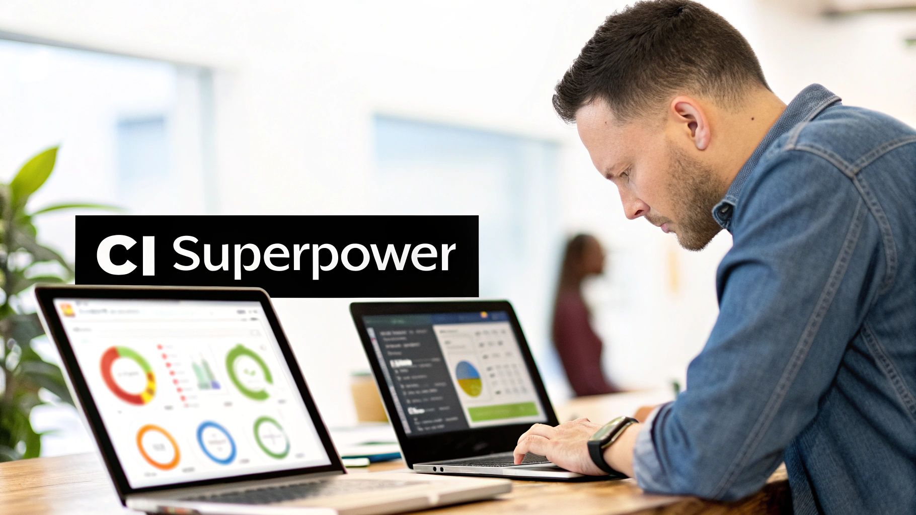 Man focused on a laptop displaying data visualizations and charts for competitive intelligence.