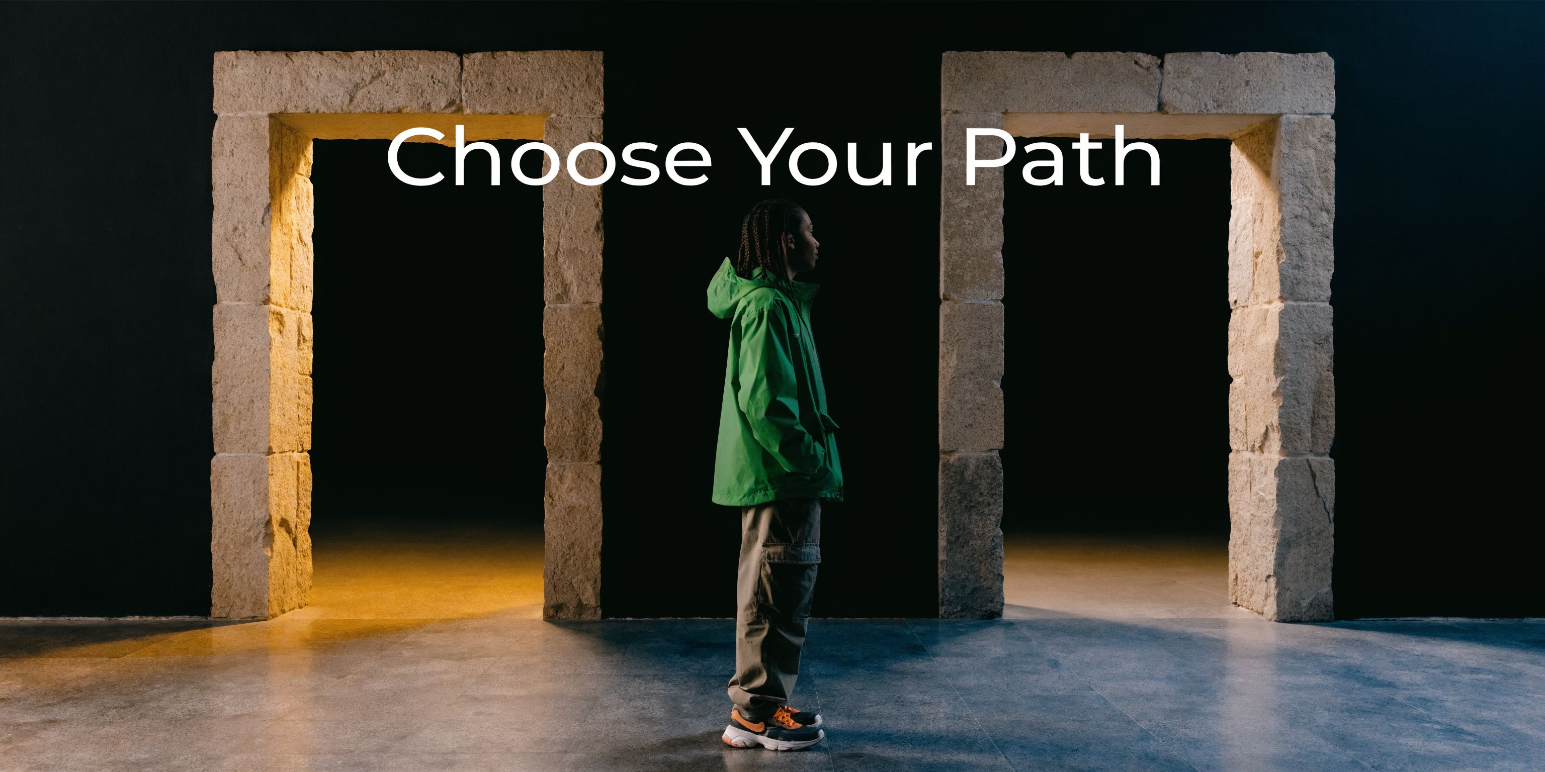 A young person standing between two stone archways in a dark room with the text Choose Your Path.