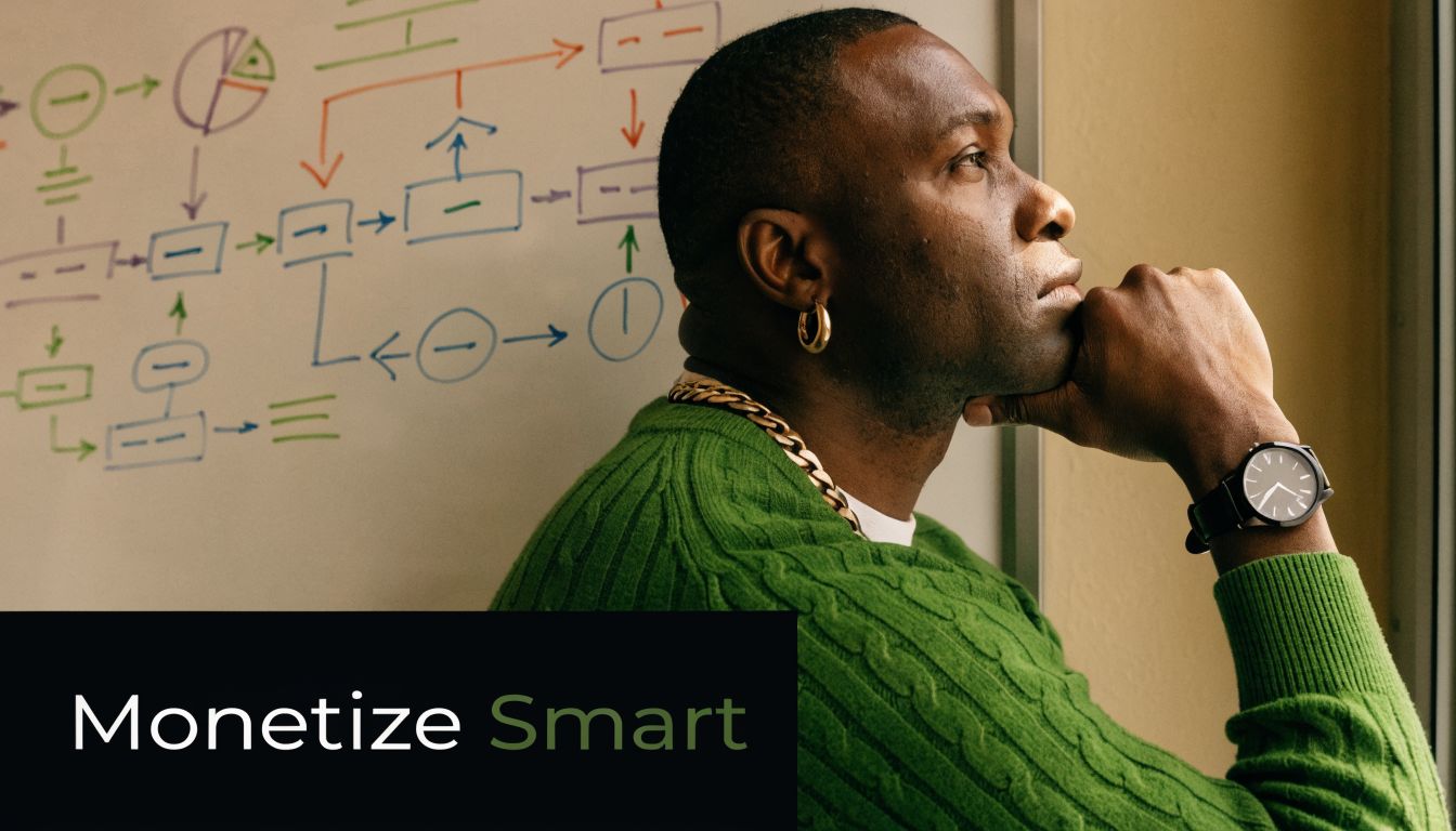 A thoughtful man wearing a green sweater looks at a complex flowchart drawn on a whiteboard.
