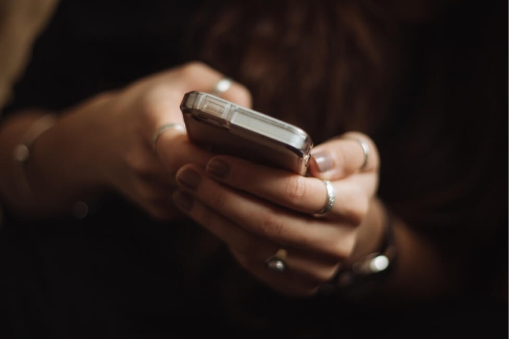 Two hands holding a mobile phone