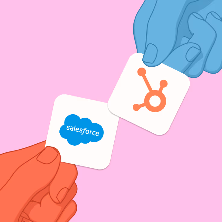 Illustrated red and blue hands holding tiles with Salesforce and HubSpot logos against a pink background.