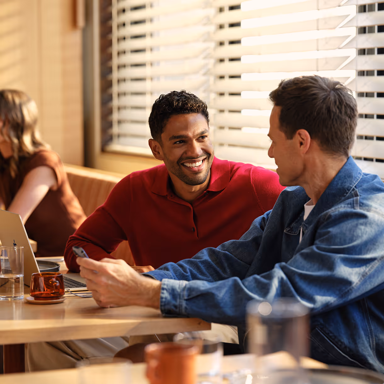 Salesperson reviewing AI-generated meeting notes attached to a Blinq digital business card contact