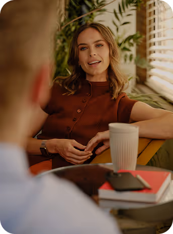 Two professionals connecting at a business event, ready to exchange contact details.