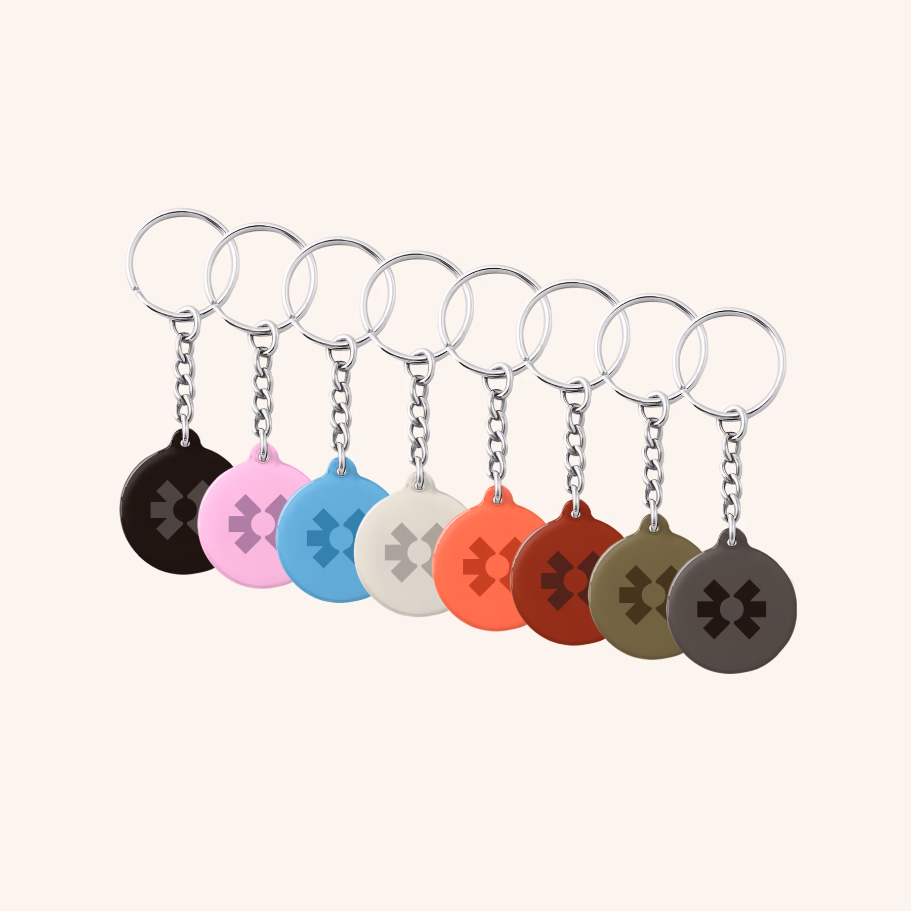 Eight Blinq NFC keychains on split rings in black, pink, blue, cream, coral, red, olive and grey
