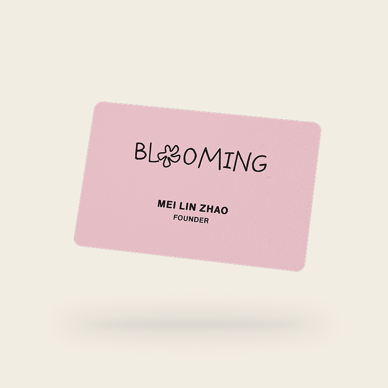 Eight custom Blinq NFC business cards fanned out, each printed with a different company logo, name and job title