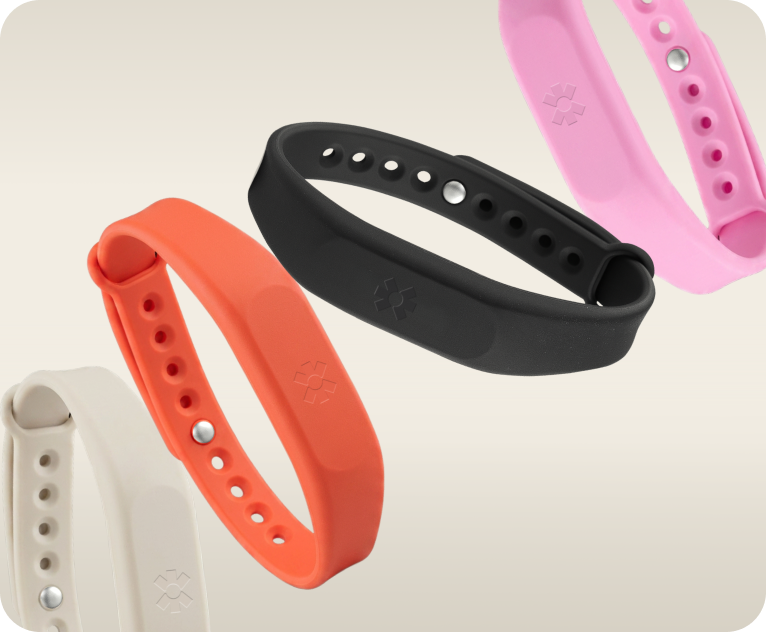 Blinq NFC wristbands in black, coral, pink and cream